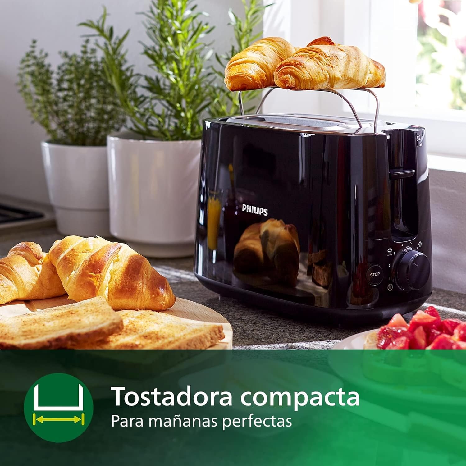 Rejilla calientabollos desplegada sobre la tostadora Philips HD2581/90 con bollería